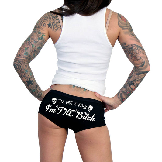 This image features a pair of bold and expressive "Hot Leathers PTB7439 I'm 'THE' Bitch Ladies Boy Shorts." The shorts are black with a striking graphic print on the back, featuring the phrase "I'M NOT A BITCH, I'M 'THE' BITCH" in white letters, creating a striking contrast.