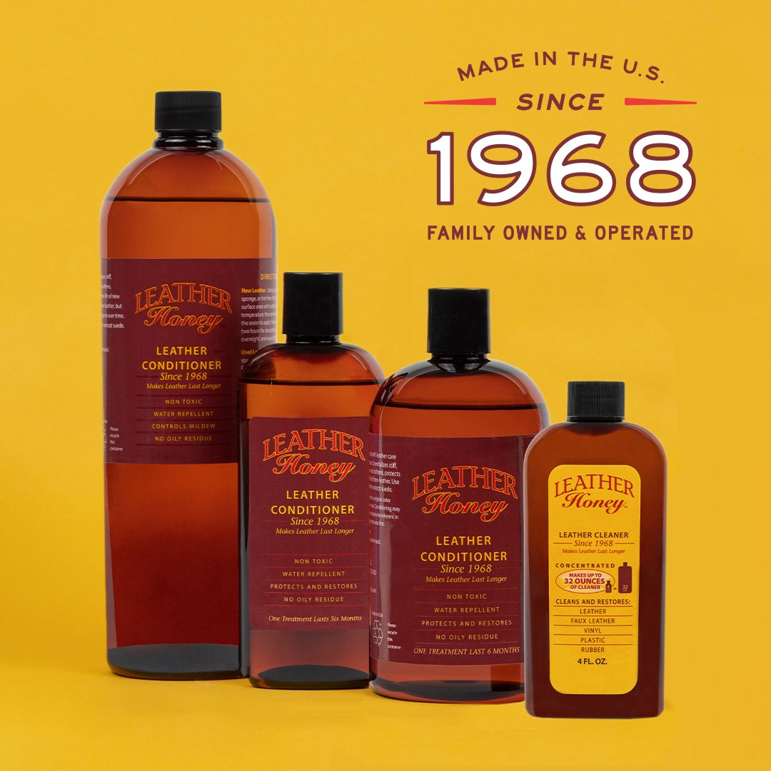 Bottles of Leather Honey leather conditioner on a yellow background with branding text.