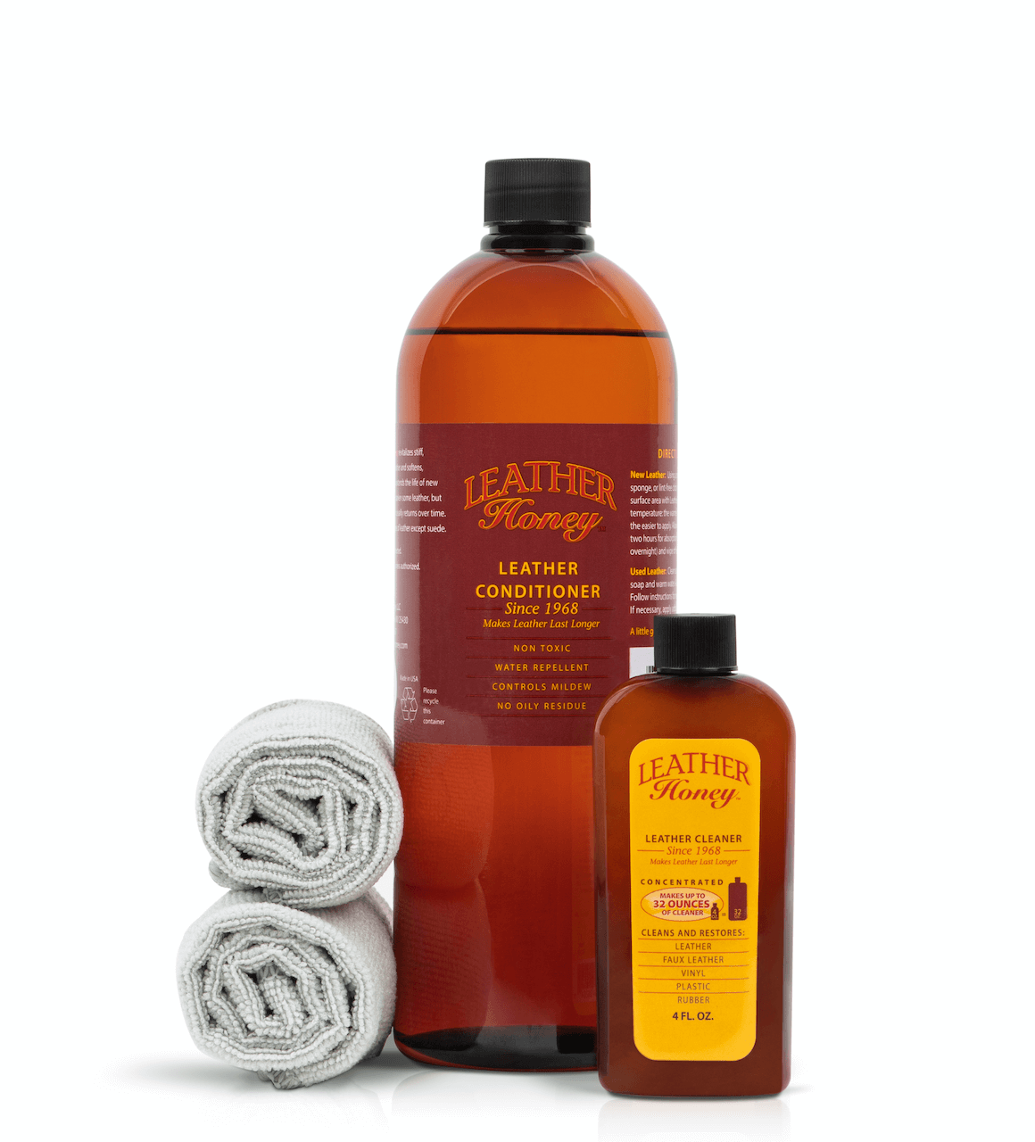Two bottles of Leather Honey leather conditioner with cloths on a white background