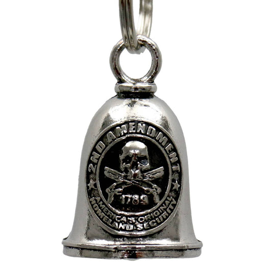 A silver-colored metal motorcycle good luck bell with a key ring, featuring an embossed design including a skull and crossbones emblem.