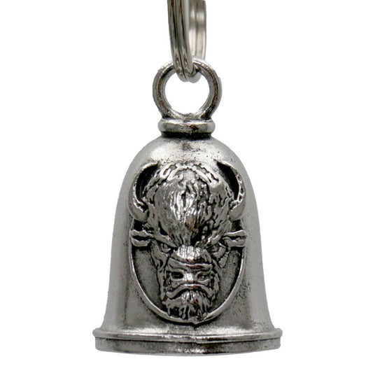 A silver-colored metal motorcycle good luck bell with a key ring, featuring an embossed design of a buffalo on the front.