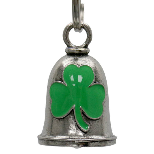 A silver-colored motorcycle good luck bell with a green clover design on the front, attached to a key ring.