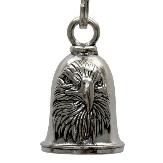 A silver-colored metal bell with an embossed eagle design, includes a key ring attached at the top.
