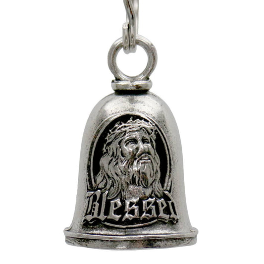 A silver-colored metal bell with a key ring, featuring an embossed design of a bearded figure and the word 'Blessed'.