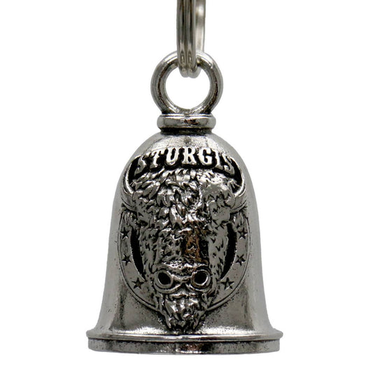 A silver motorcycle good luck bell with 'STURGIS' written on it and a key ring attached.