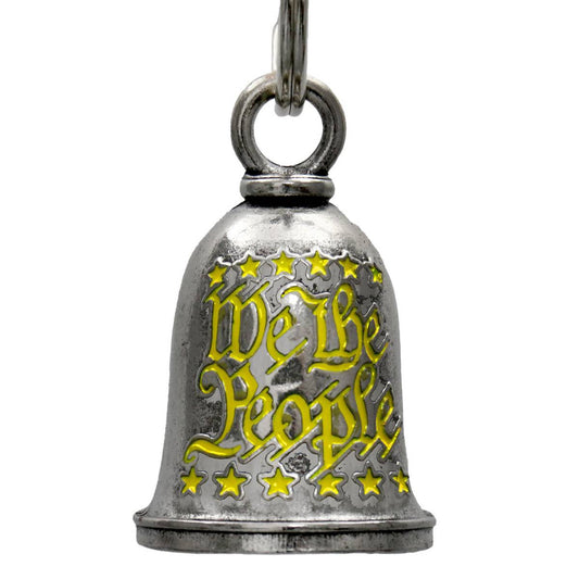 A silver motorcycle good luck bell with 'We The People' text and stars pattern, attached to a key ring.