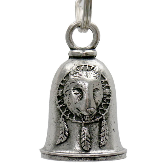 A silver-colored metal motorcycle good luck bell with a key ring, featuring an embossed design of a wolf's face with dreamcatcher elements around it.