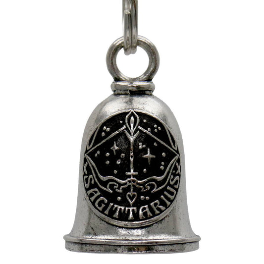 A silver-colored metal bell with a key ring, featuring a decorative pattern and the word 'SAGITTARIUS' engraved on it.