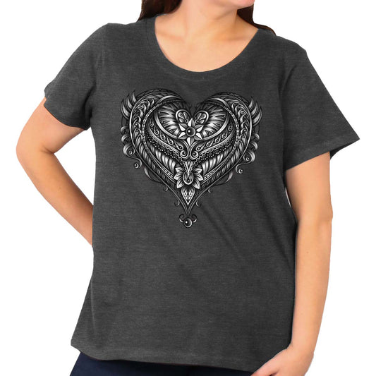 A woman wearing a gray ladies t-shirt with an ornate angel wings curvy graphic print in the shape of a heart.