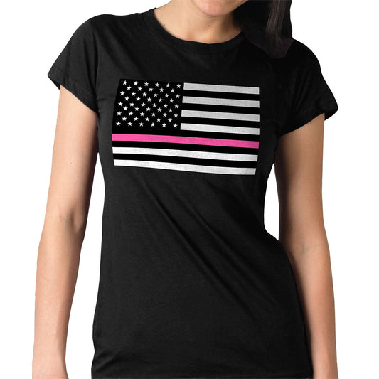 A woman wearing a black short-sleeved t-shirt with a graphic print of the American flag featuring a pink horizontal line.