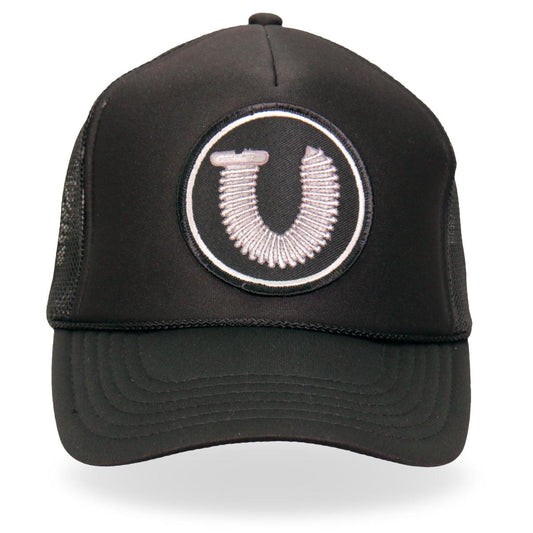 A black Hot Leathers trucker hat with a white embroidered patch on the front panel, featuring a mesh back and an adjustable snap closure.