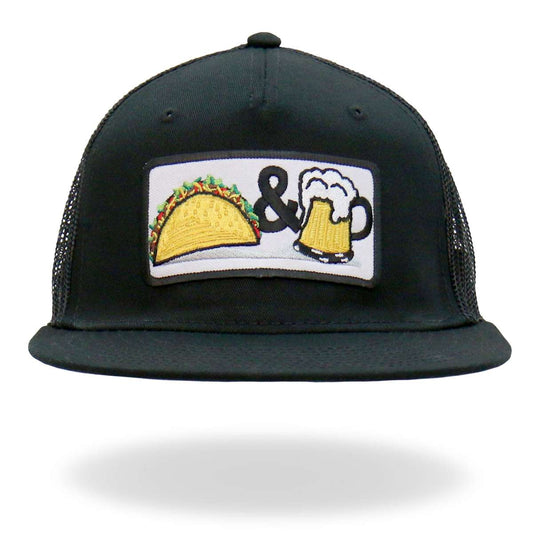 A black snapback trucker hat with a flat bill featuring a graphic print of a taco and a beer mug.