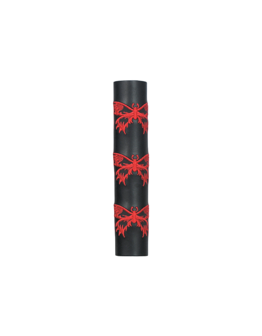 Black leather cylindrical hair tube product with red butterfly patterns on a white background