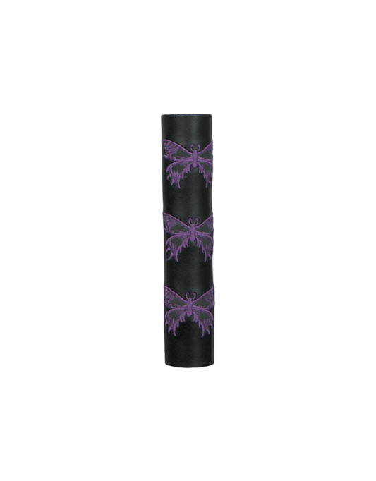 Black leather cylindrical hair tube product with purple butterfly designs on a white background