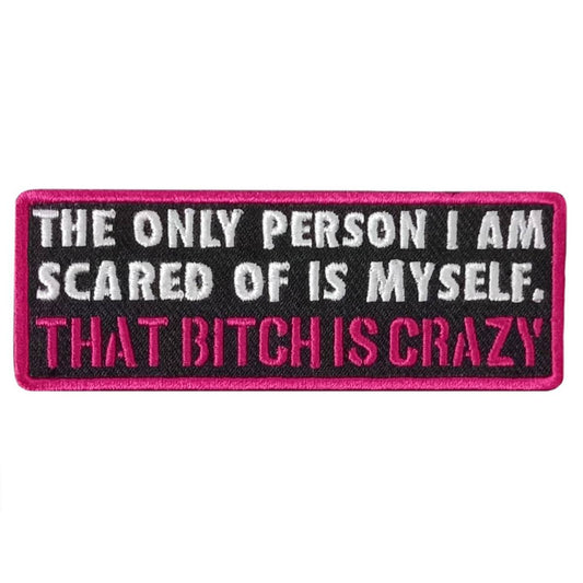A rectangular black, red, and white embroidered patch with the text 'THE ONLY PERSON I AM SCARED OF IS MYSELF. THAT BITCH IS CRAZY'.