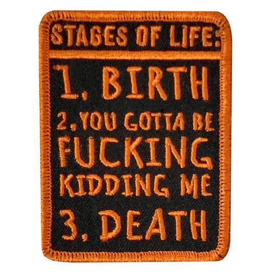 A rectangular black and orange embroidered patch with the text 'STAGES OF LIFE 1. BIRTH 2.