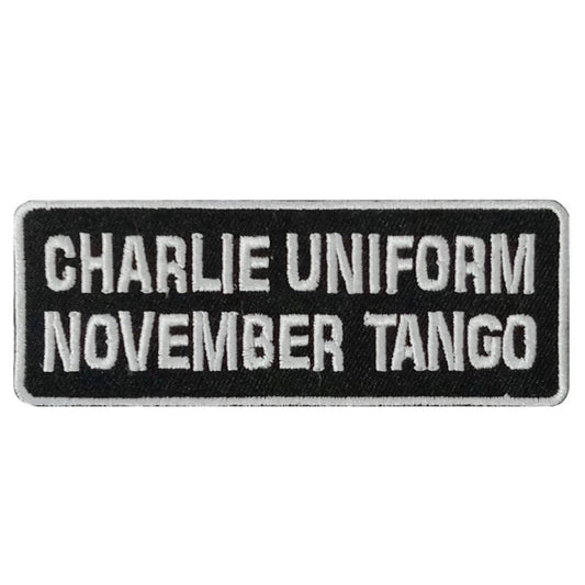 A rectangular black patch with white text 'CHARLIE UNIFORM NOVEMBER TANGO' and a silver border.