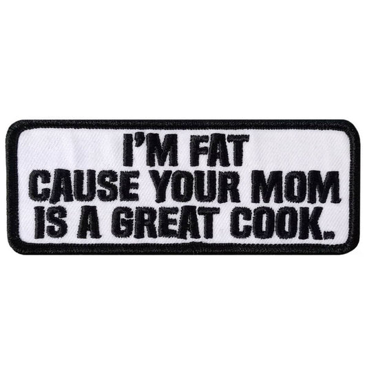 A rectangular black and white patch with the text 'I'M FAT CAUSE YOUR MOM IS A GREAT COOK.'