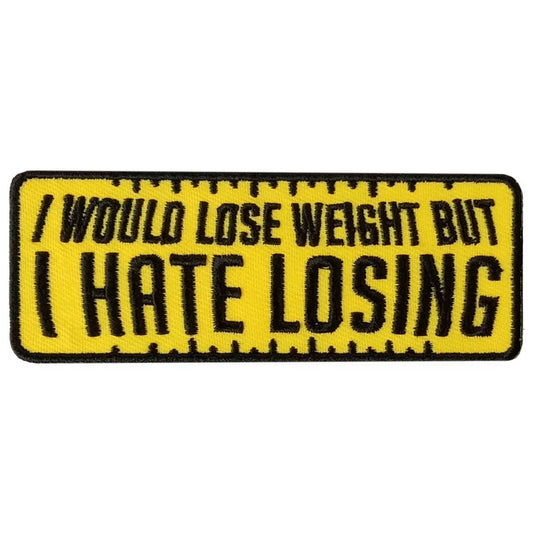 A yellow and black embroidered patch with the text 'I WOULD LOSE WEIGHT BUT I HATE LOSING'.